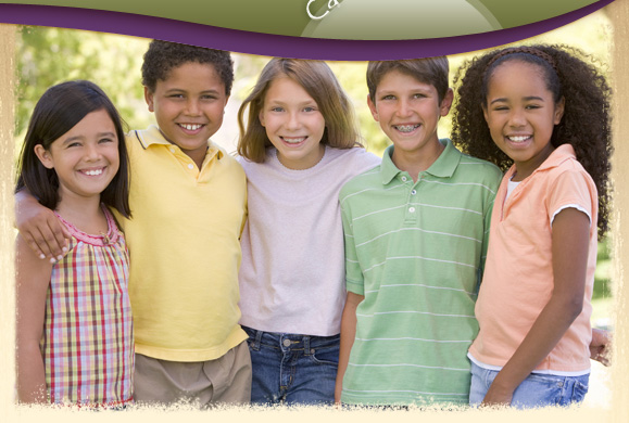 group of kids smiling with braces