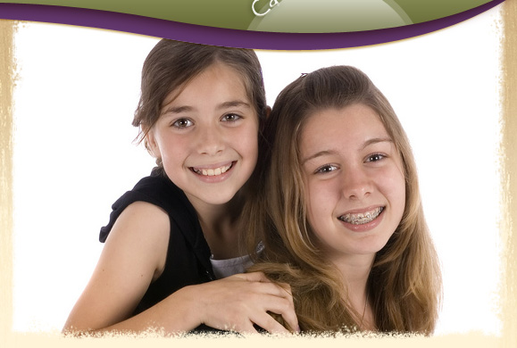 young girls smiling with braces